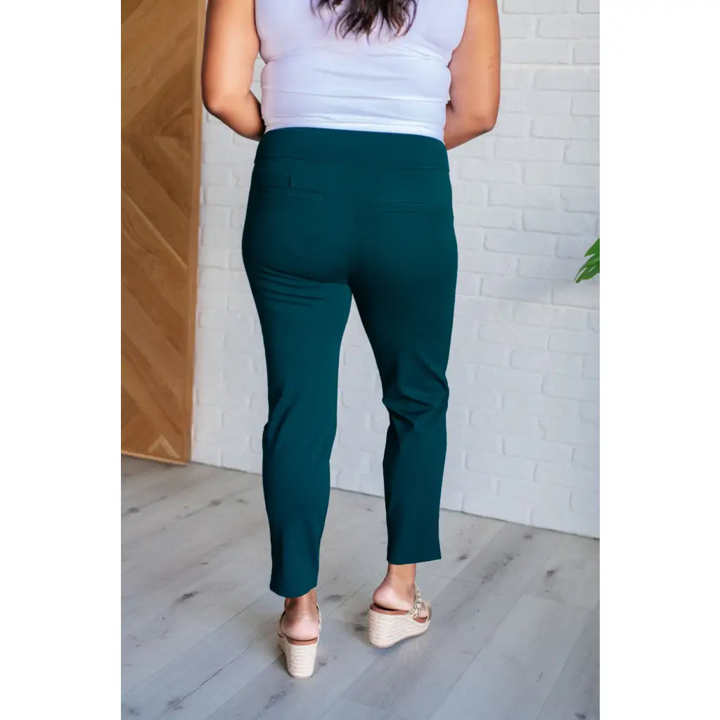Our Magic Skinny Pants in Hunter Green are high rise ankle cropped pants featuring a slim fit and ponte knit