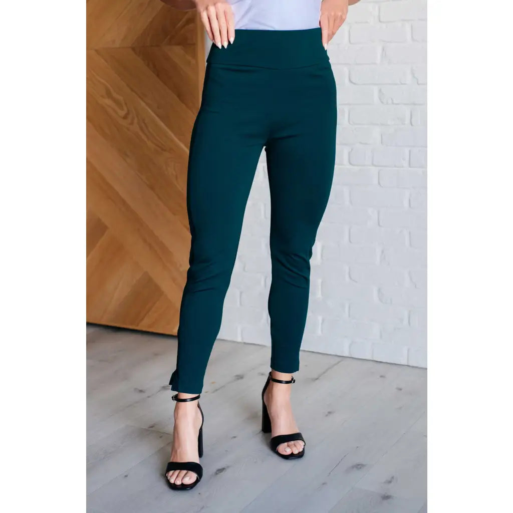 Our Magic Skinny Pants in Hunter Green are high rise ankle cropped pants featuring a slim fit and ponte knit