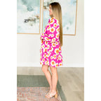 Introducing our Magnificently Mod Floral Shirt Dress! Featuring a vibrant floral print flattering collared neckline