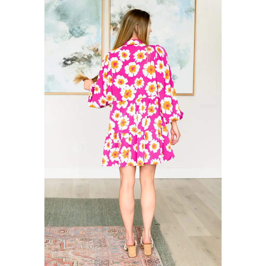 Introducing our Magnificently Mod Floral Shirt Dress! Featuring a vibrant floral print flattering collared neckline