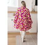 Introducing our Magnificently Mod Floral Shirt Dress! Featuring a vibrant floral print flattering collared neckline