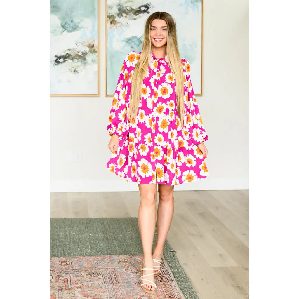 Introducing our Magnificently Mod Floral Shirt Dress! Featuring a vibrant floral print flattering collared neckline