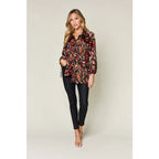 Chic abstract print tunic blouse with flowy fit and ruffled neckline. Sizes SM–3XL. Perfect plus size office top