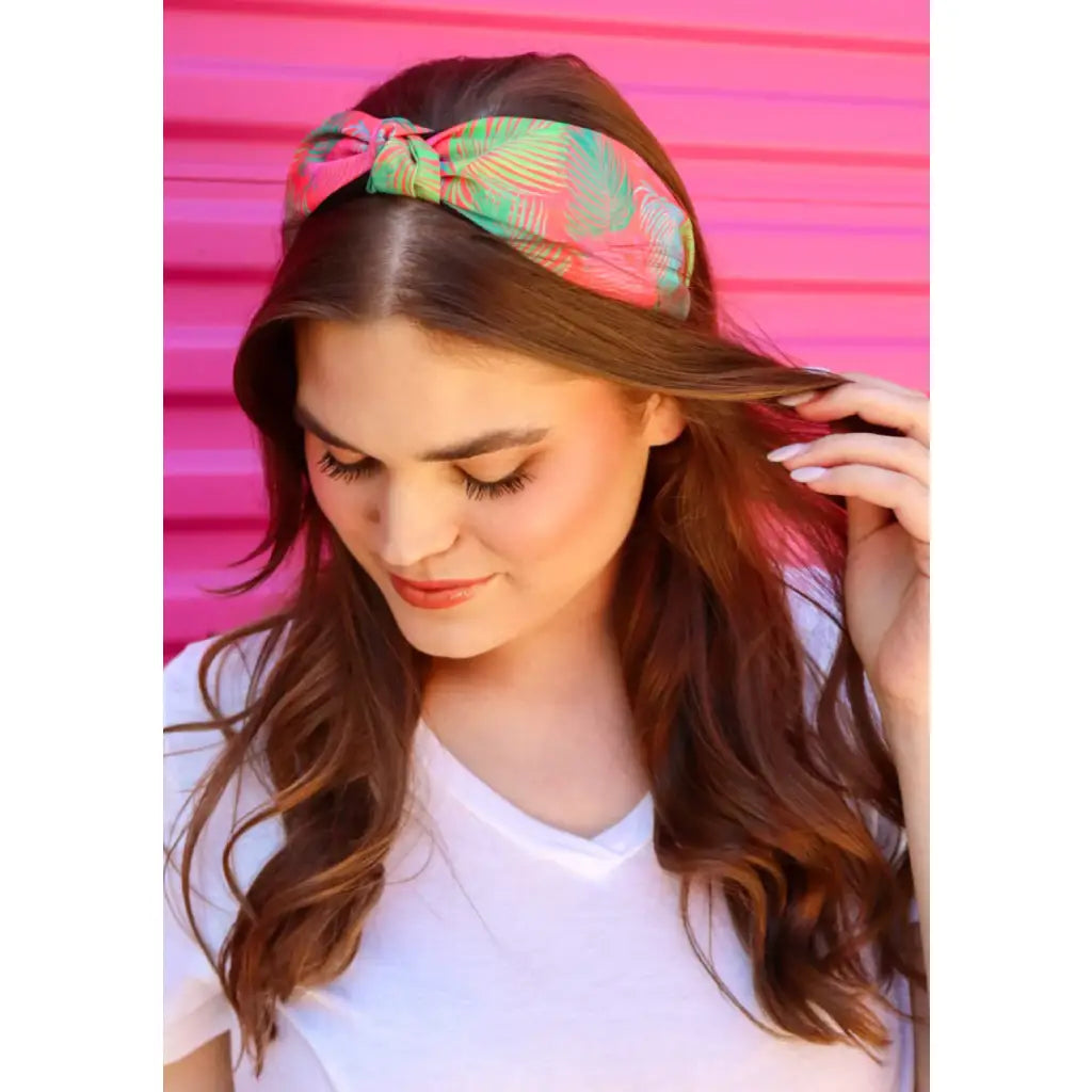 Introducing our new Malibu Sunset Knot Headband. This top knot headband features a colorful palm print that is sure