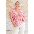 Stay on trend with our A Matter of Time Flutter Sleeve Top in Multi Pink! This woven top features a flattering