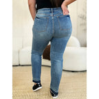 Discover the chic Judy Blue Mid Rise Rigid Magic Release Hem Jeans available in regular curvy and plus sizes. Shop