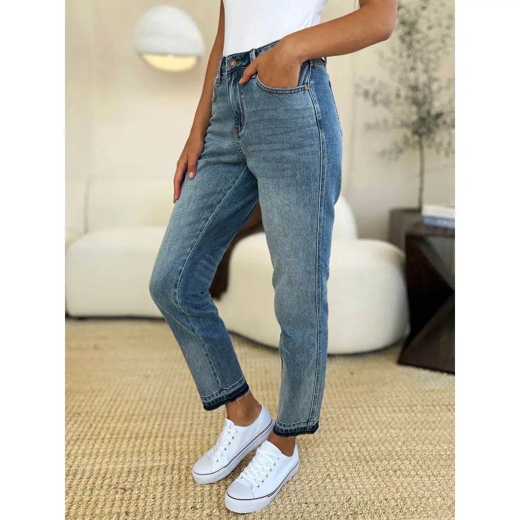 Discover the chic Judy Blue Mid Rise Rigid Magic Release Hem Jeans available in regular curvy and plus sizes. Shop