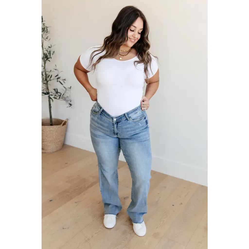 Get ready to redefine your denim game with our Mildred High Rise V Front Waistband Straight Jeans from Judy Blue!