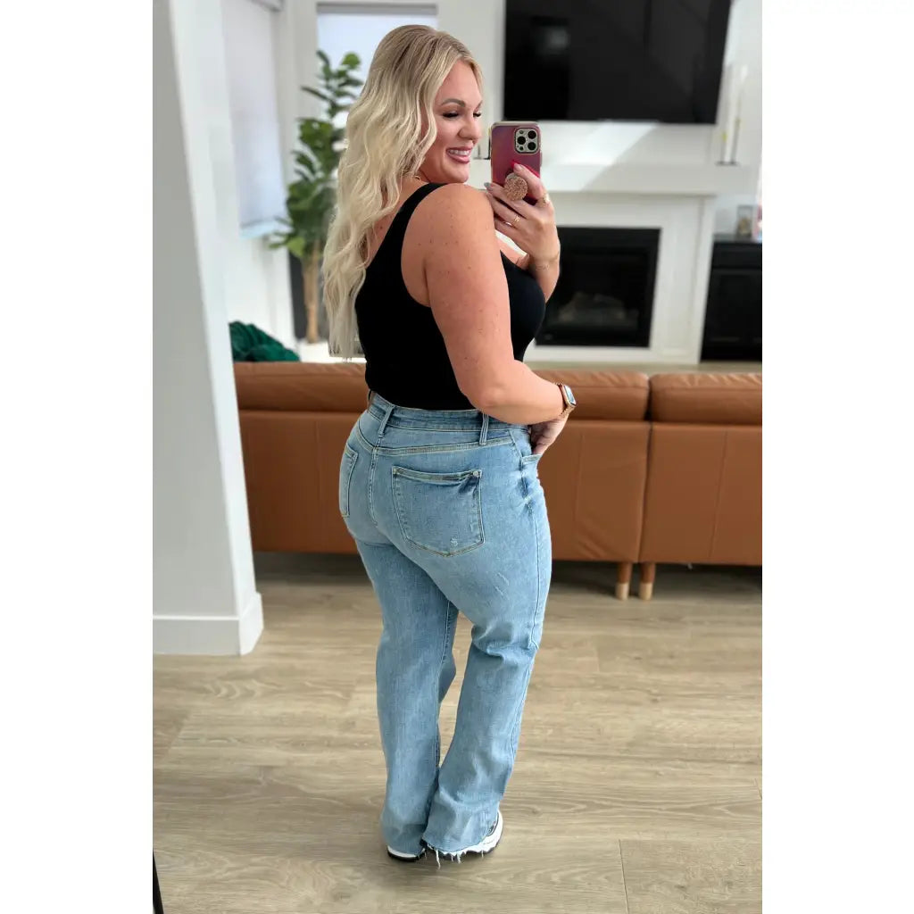 Get ready to redefine your denim game with our Mildred High Rise V Front Waistband Straight Jeans from Judy Blue!
