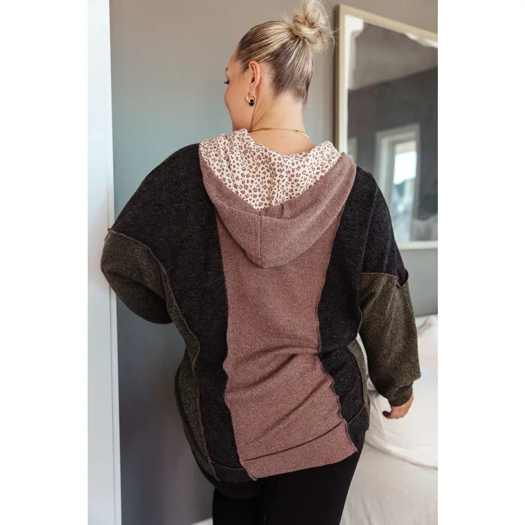 Look cozy and stylish in our Mixed Emotions Leopard Lined Hoodie. Enjoy the comfort of soft knit fabric dolman sleeves