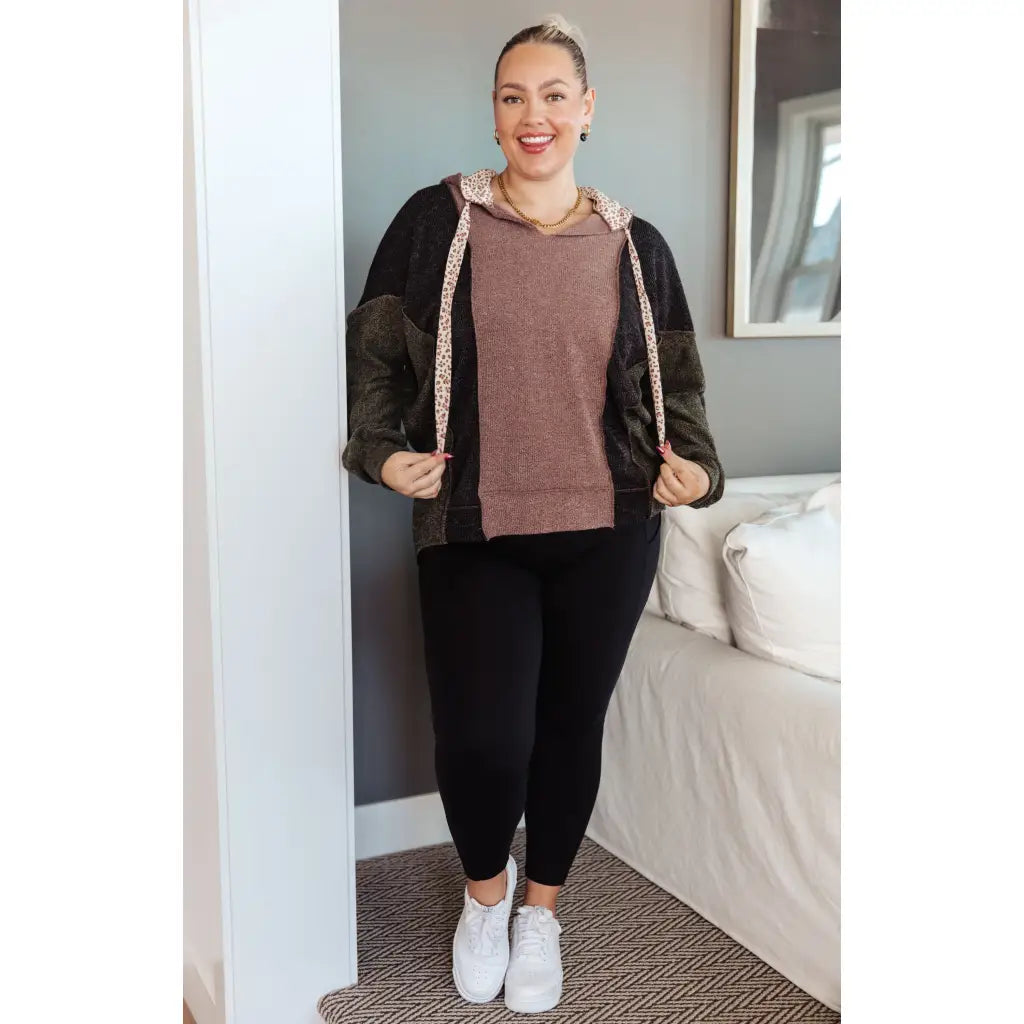 Look cozy and stylish in our Mixed Emotions Leopard Lined Hoodie. Enjoy the comfort of soft knit fabric dolman sleeves