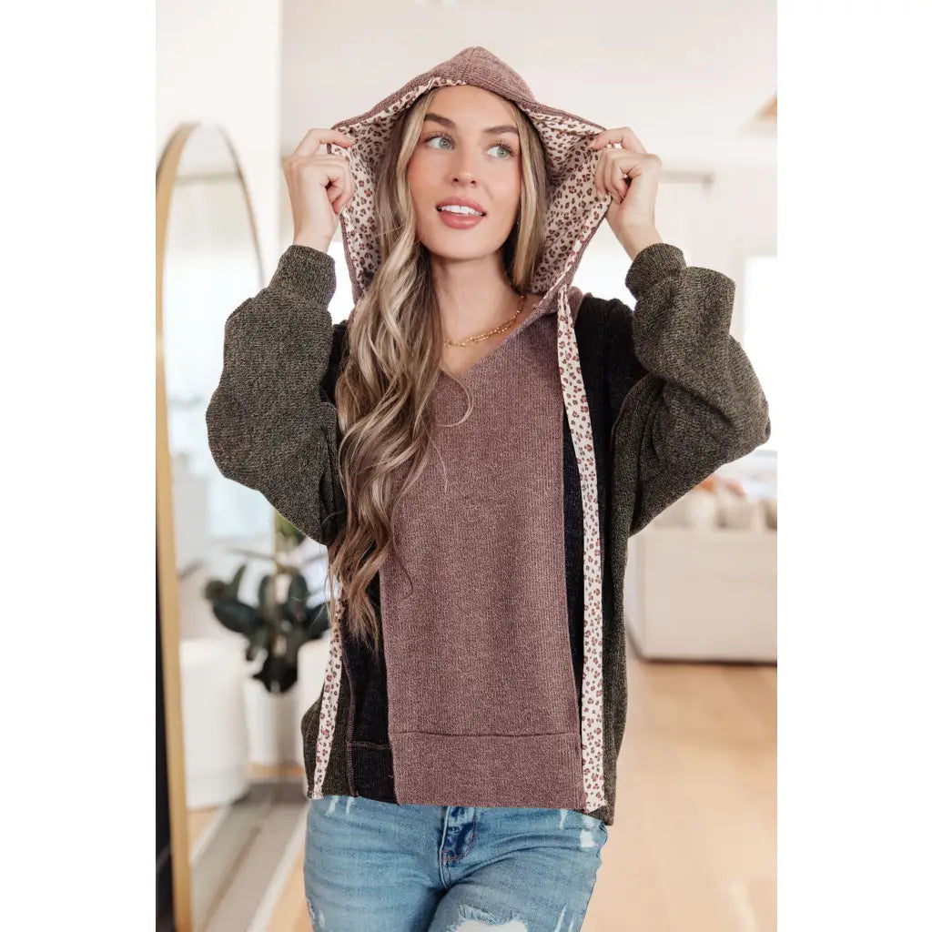 Look cozy and stylish in our Mixed Emotions Leopard Lined Hoodie. Enjoy the comfort of soft knit fabric dolman sleeves