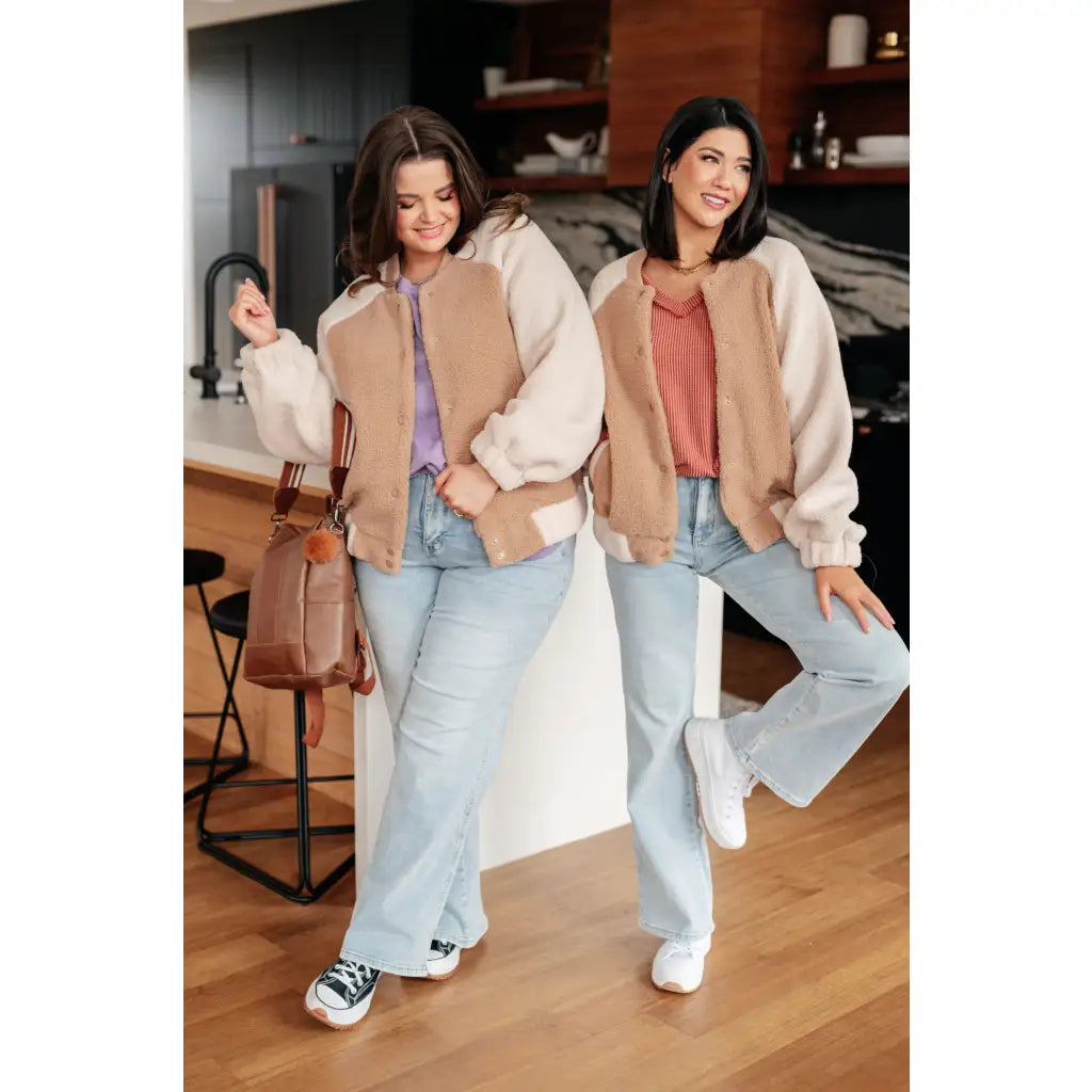 Stay warm and stylish in our Mocha Latte Bomber Jacket. Soft Sherpa fleece with plus size fit for the perfect cozy