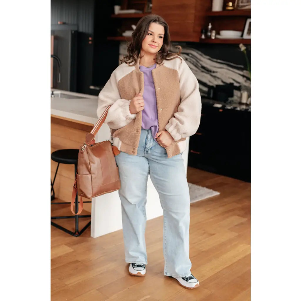 Stay warm and stylish in our Mocha Latte Bomber Jacket. Soft Sherpa fleece with plus size fit for the perfect cozy