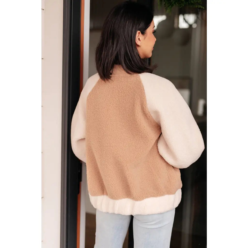 Stay warm and stylish in our Mocha Latte Bomber Jacket. Soft Sherpa fleece with plus size fit for the perfect cozy