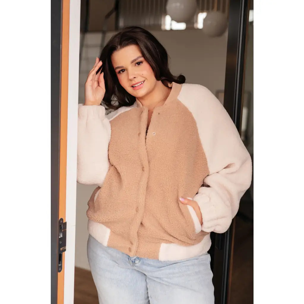 Stay warm and stylish in our Mocha Latte Bomber Jacket. Soft Sherpa fleece with plus size fit for the perfect cozy