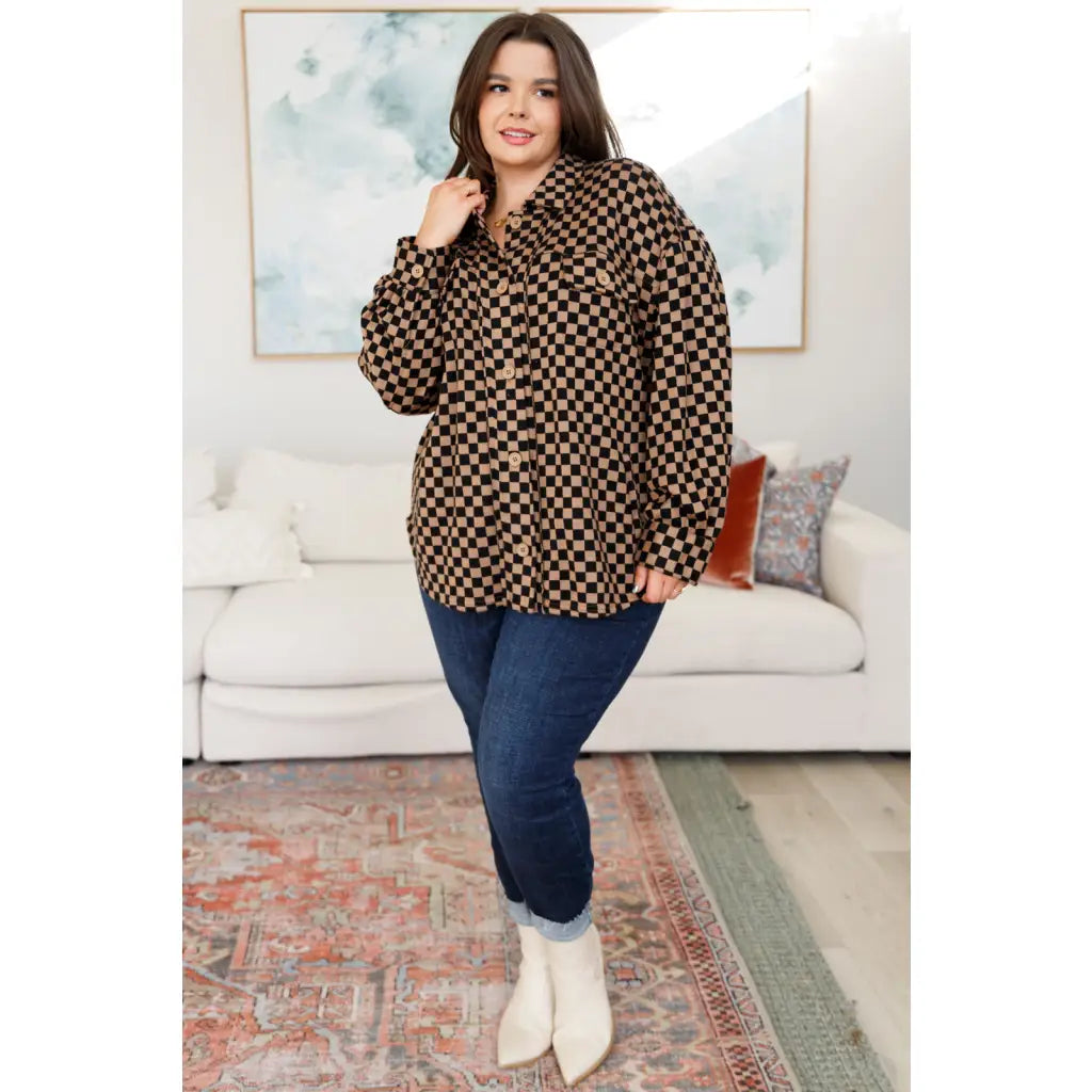 Stay cozy in the mocha latte and black checkered shacket with brushed woven fabric exposed seams a relaxed fit. Plus