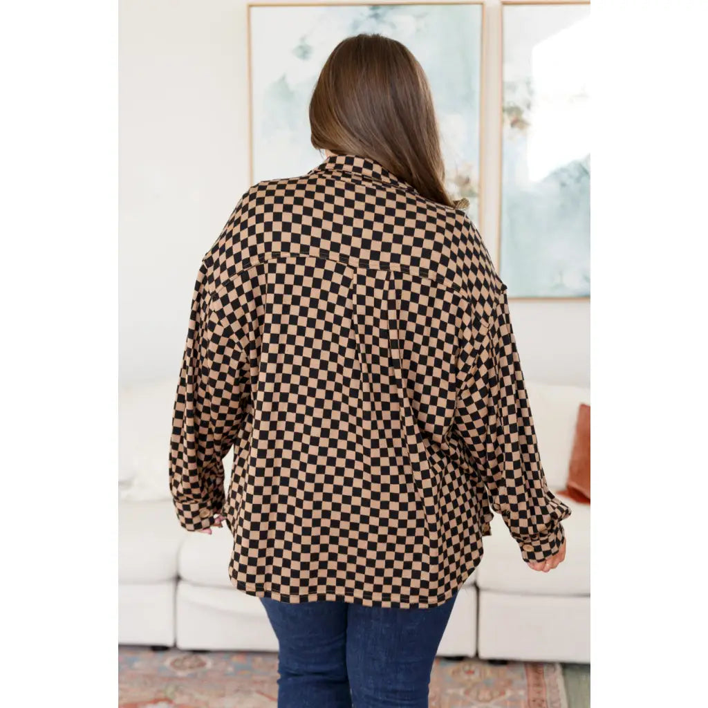 Stay cozy in the mocha latte and black checkered shacket with brushed woven fabric exposed seams a relaxed fit. Plus
