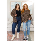 Stay cozy in the mocha latte and black checkered shacket with brushed woven fabric exposed seams a relaxed fit. Plus