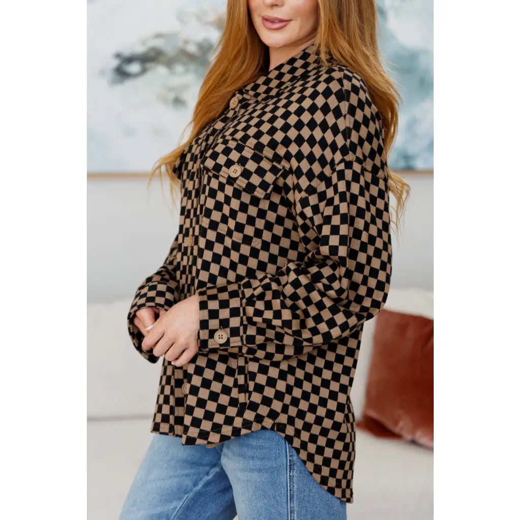 Stay cozy in the mocha latte and black checkered shacket with brushed woven fabric exposed seams a relaxed fit. Plus