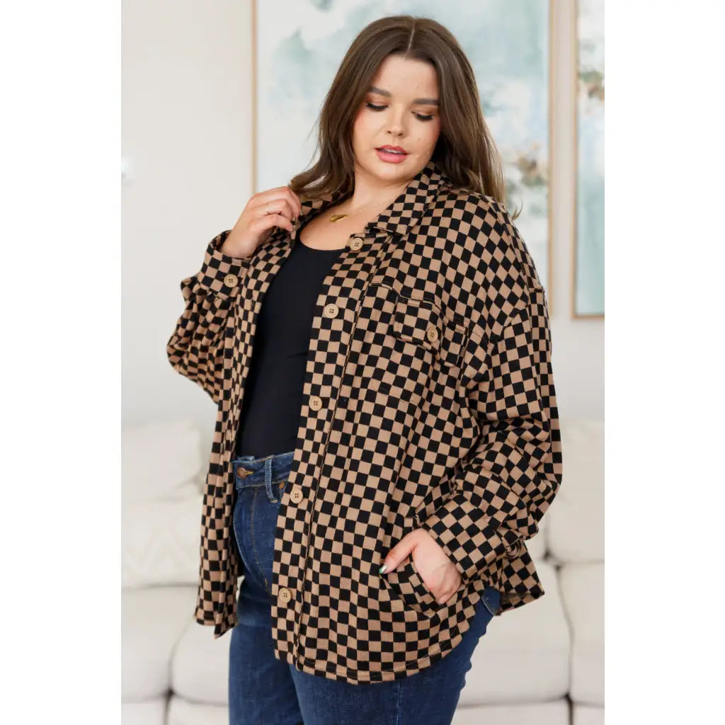 Stay cozy in the mocha latte and black checkered shacket with brushed woven fabric exposed seams a relaxed fit. Plus