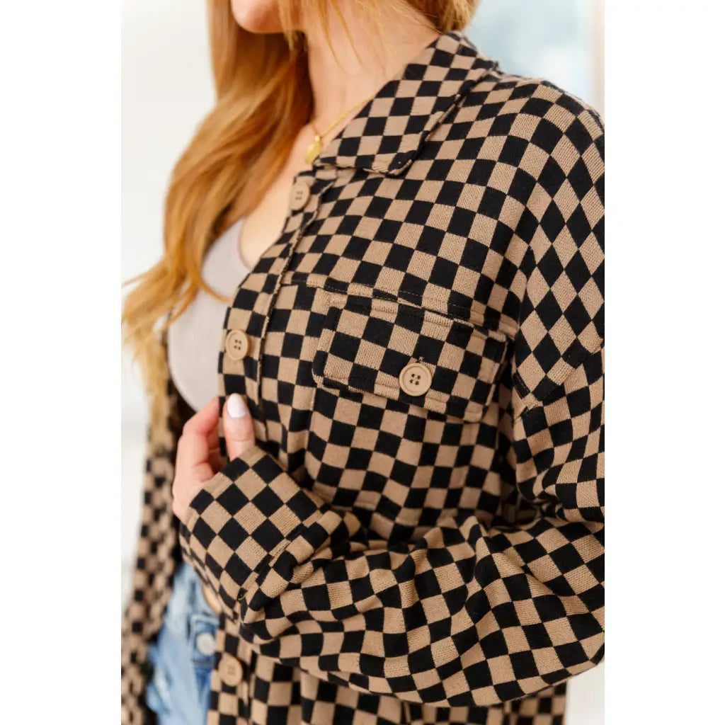 Stay cozy in the mocha latte and black checkered shacket with brushed woven fabric exposed seams a relaxed fit. Plus