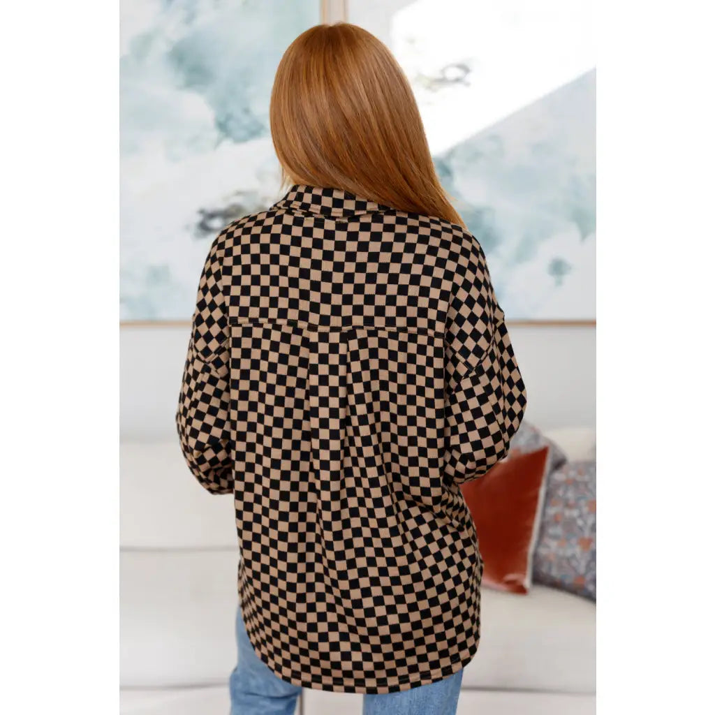 Stay cozy in the mocha latte and black checkered shacket with brushed woven fabric exposed seams a relaxed fit. Plus