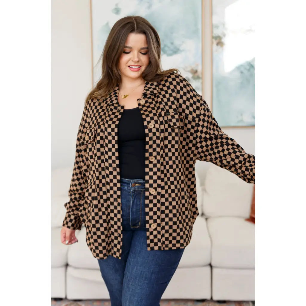 Stay cozy in the mocha latte and black checkered shacket with brushed woven fabric exposed seams a relaxed fit. Plus