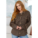 Stay cozy in the mocha latte and black checkered shacket with brushed woven fabric exposed seams a relaxed fit. Plus