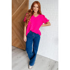 Hot pink puff sleeve blouse with V-neck and flowy fit. Available in standard curvy plus sizes. Lightweight bold &