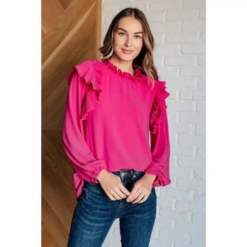 Discover the My Good Graces Ruffled Blouse a romantic pink mock neck top with balloon sleeves. Plus it’s available