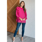Discover the My Good Graces Ruffled Blouse a romantic pink mock neck top with balloon sleeves. Plus it’s available
