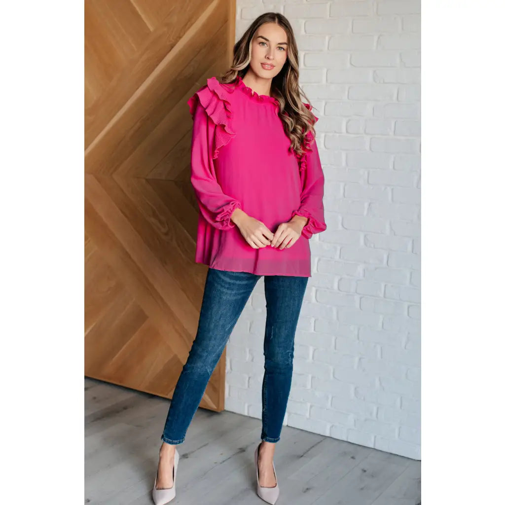 Discover the My Good Graces Ruffled Blouse a romantic pink mock neck top with balloon sleeves. Plus it’s available