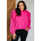 Discover the My Good Graces Ruffled Blouse a romantic pink mock neck top with balloon sleeves. Plus it’s available