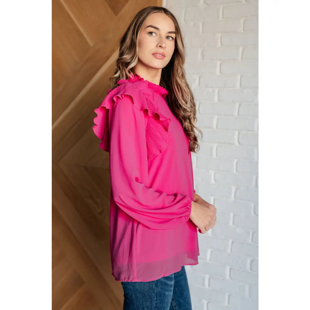 Discover the My Good Graces Ruffled Blouse a romantic pink mock neck top with balloon sleeves. Plus it’s available
