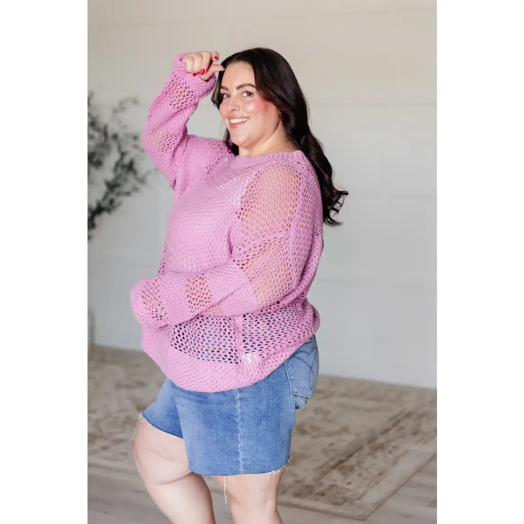 Our Latest Love sweater combines a cozy loose pink knit with block stripes for chic look. The ribbed crewe round