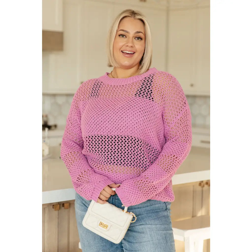 Our Latest Love sweater combines a cozy loose pink knit with block stripes for chic look. The ribbed crewe round