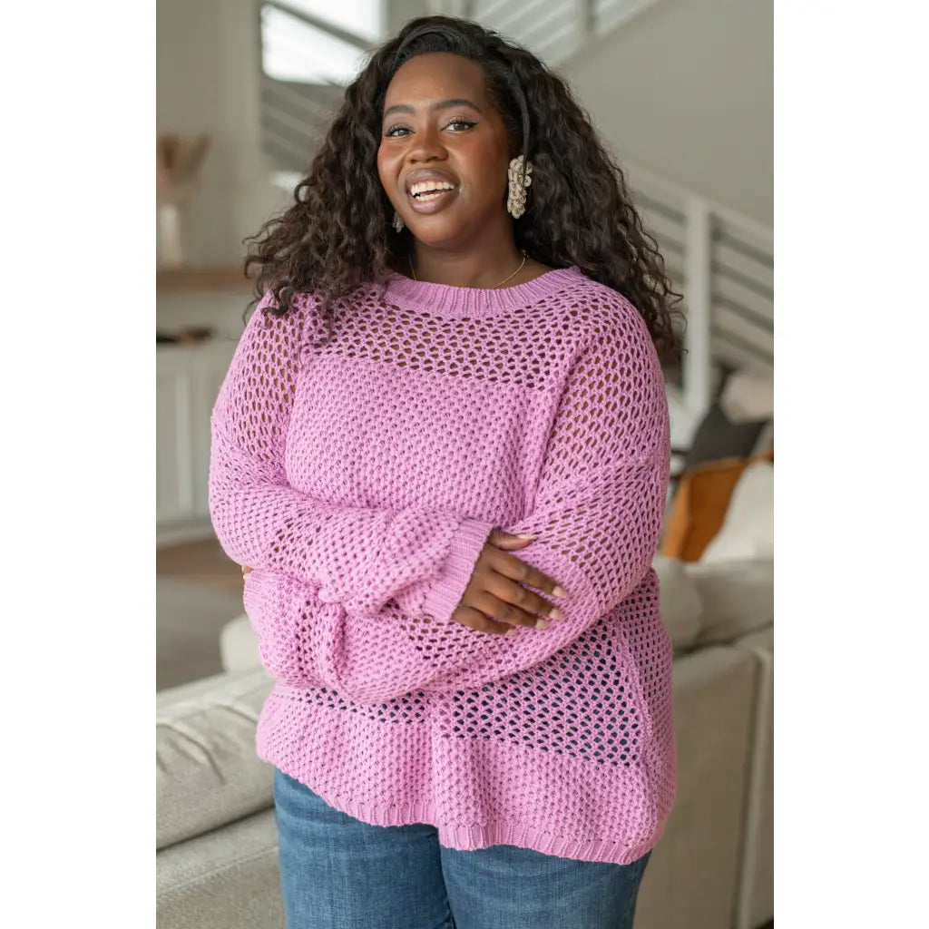 Our Latest Love sweater combines a cozy loose pink knit with block stripes for chic look. The ribbed crewe round