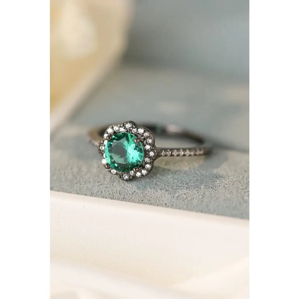 Our stunning Natural Paraiba Blue Zircon Flower Shape Ring features 925 sterling sliver that is black gold-plated
