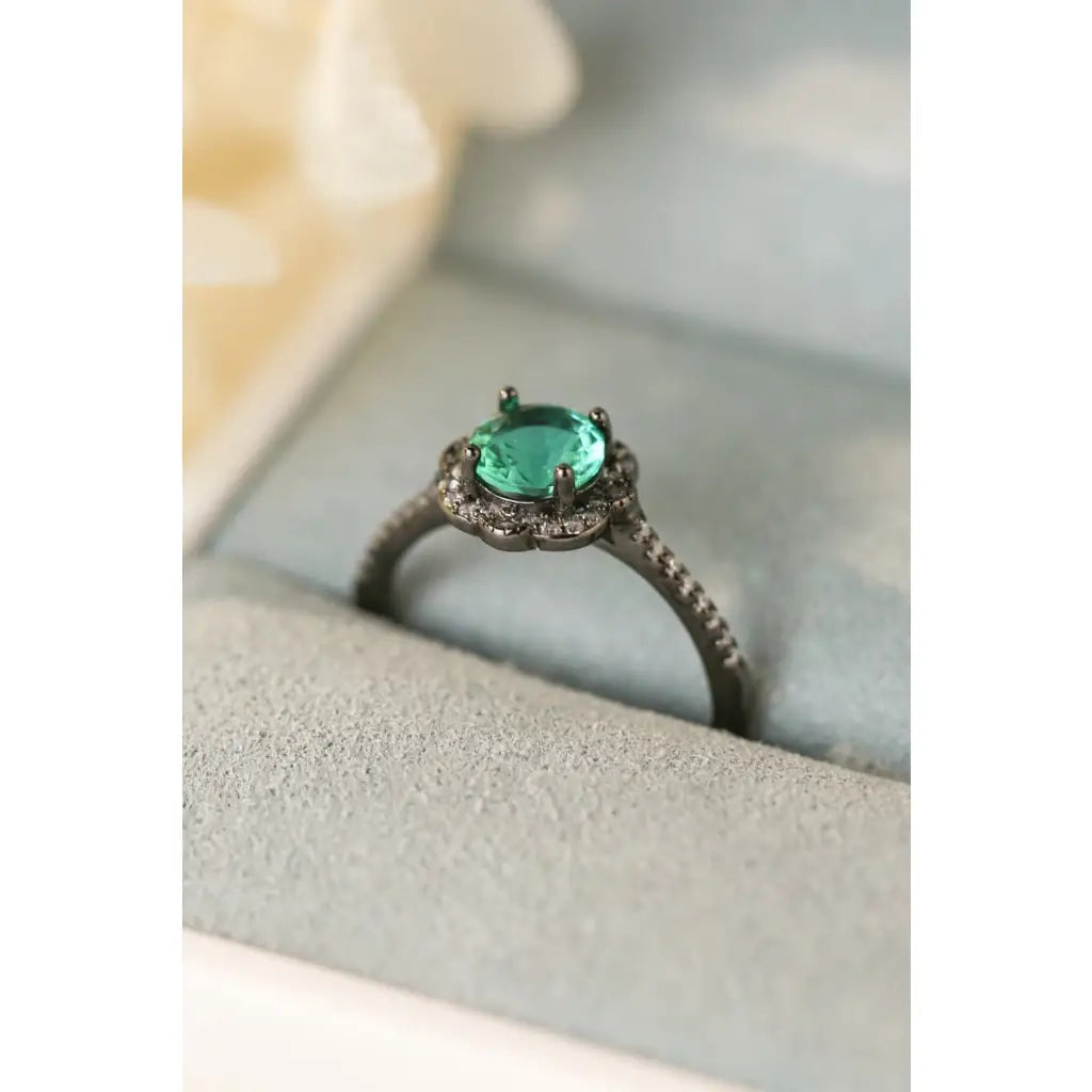 Our stunning Natural Paraiba Blue Zircon Flower Shape Ring features 925 sterling sliver that is black gold-plated