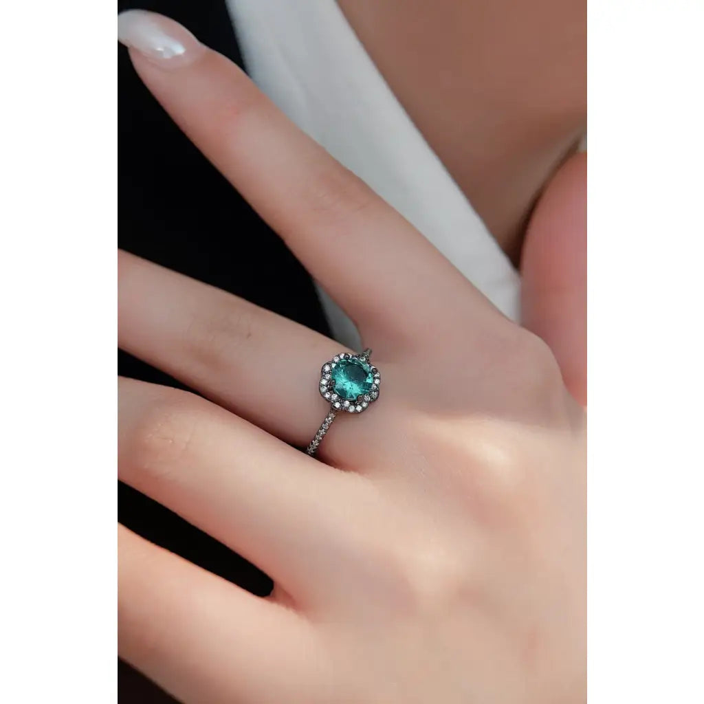 Our stunning Natural Paraiba Blue Zircon Flower Shape Ring features 925 sterling sliver that is black gold-plated