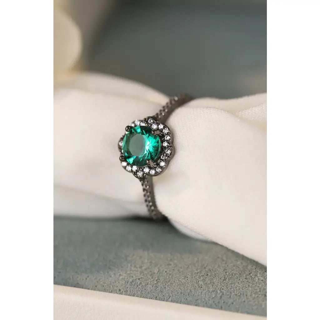 Our stunning Natural Paraiba Blue Zircon Flower Shape Ring features 925 sterling sliver that is black gold-plated