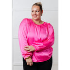 Add a touch of playful elegance to your wardrobe with our Not Exaggerating Satin Puff Sleeve Blouse. Plus it’s