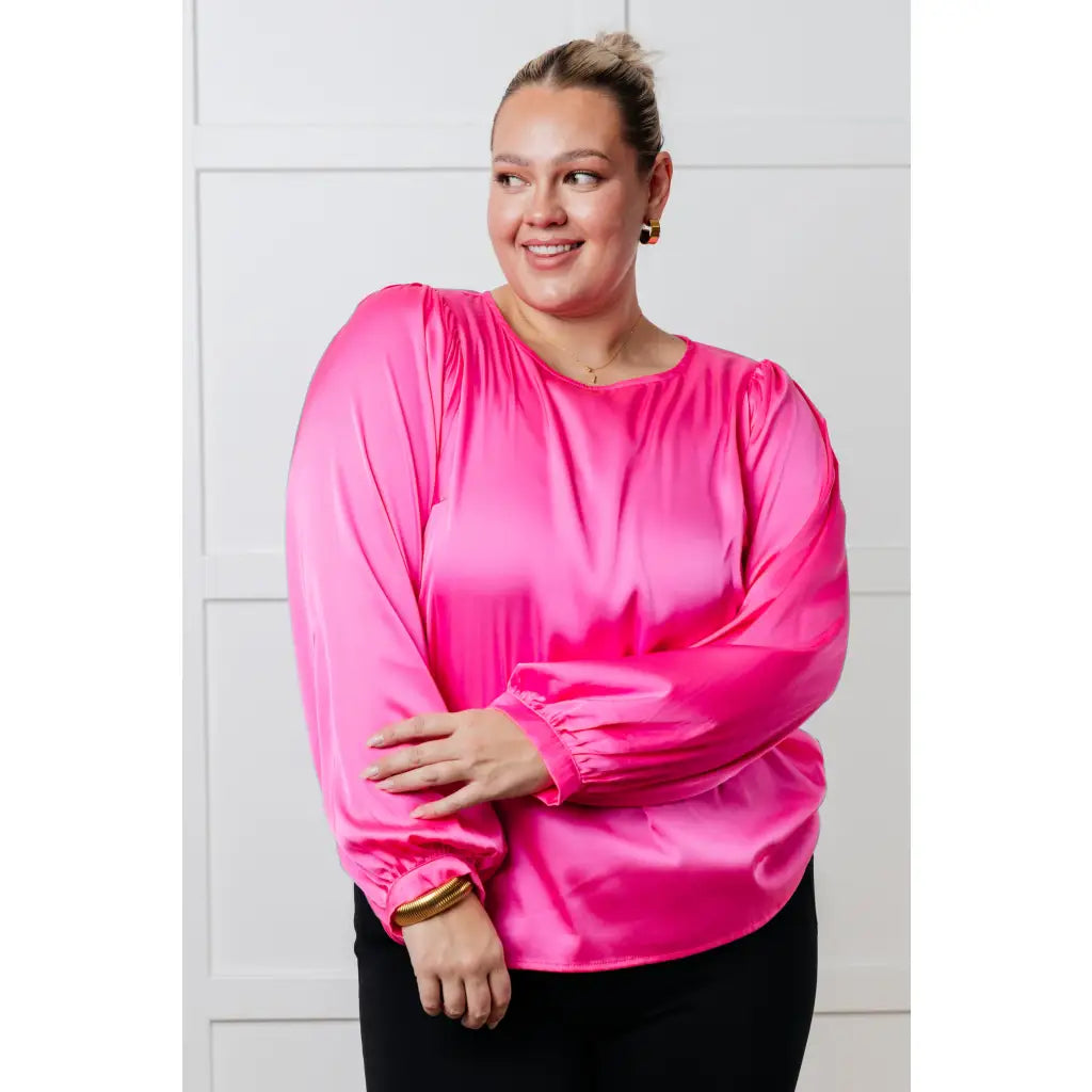 Add a touch of playful elegance to your wardrobe with our Not Exaggerating Satin Puff Sleeve Blouse. Plus it’s