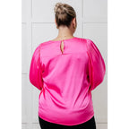 Add a touch of playful elegance to your wardrobe with our Not Exaggerating Satin Puff Sleeve Blouse. Plus it’s