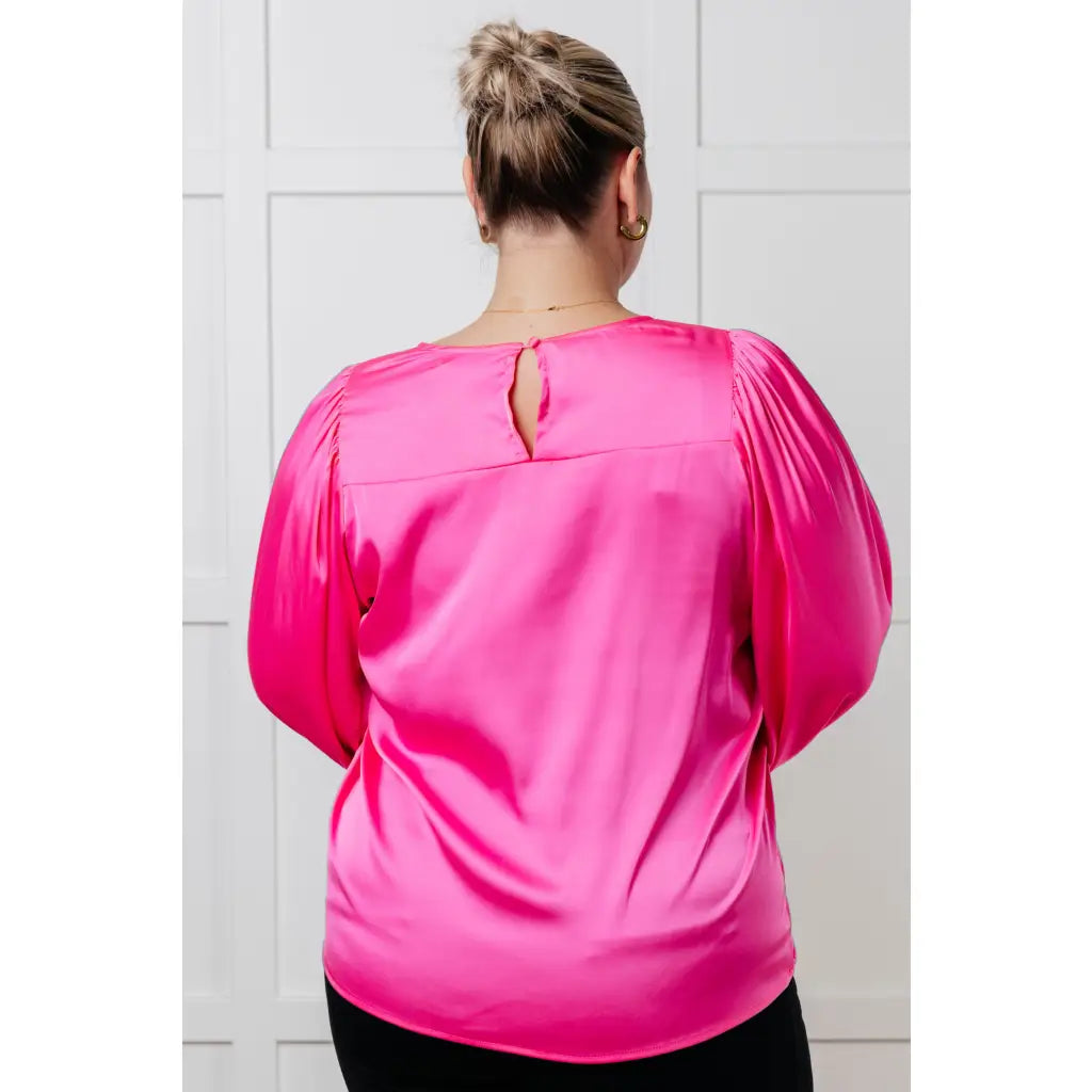 Add a touch of playful elegance to your wardrobe with our Not Exaggerating Satin Puff Sleeve Blouse. Plus it’s