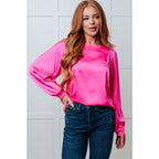 Add a touch of playful elegance to your wardrobe with our Not Exaggerating Satin Puff Sleeve Blouse. Plus it’s