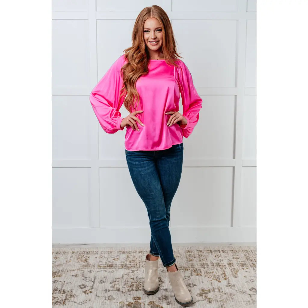 Add a touch of playful elegance to your wardrobe with our Not Exaggerating Satin Puff Sleeve Blouse. Plus it’s