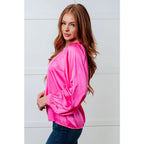 Add a touch of playful elegance to your wardrobe with our Not Exaggerating Satin Puff Sleeve Blouse. Plus it’s