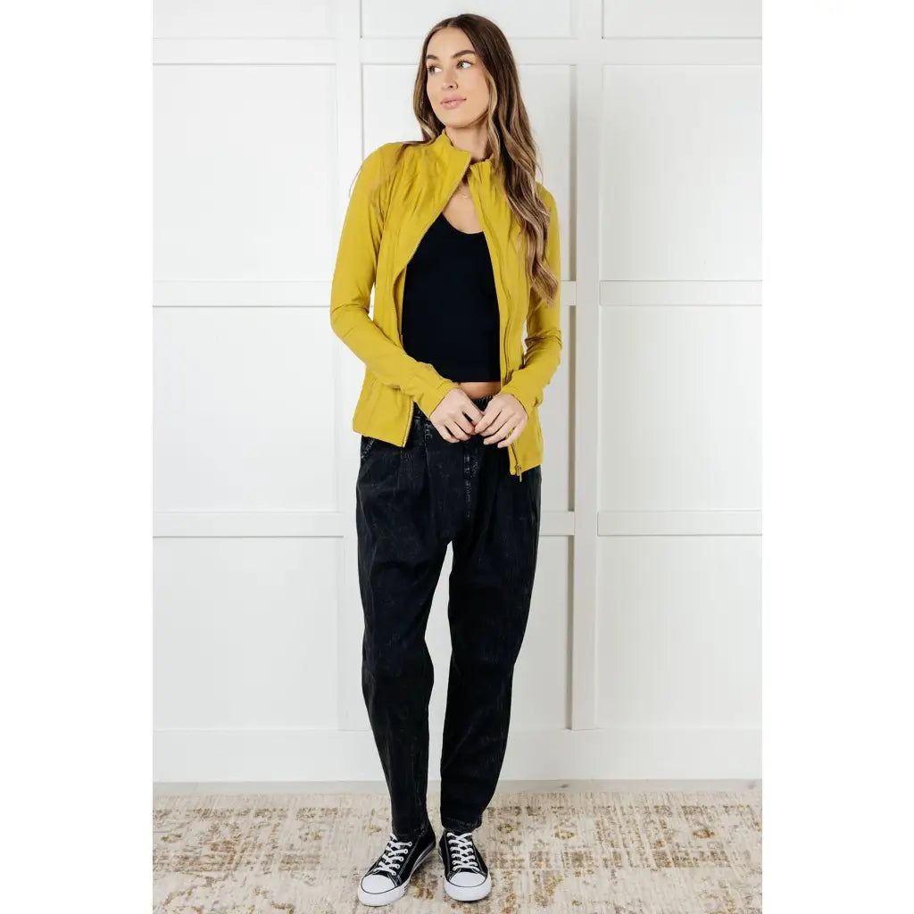 Our Pear-fectly Yellow Activewear Jacket is form-fitting and features a brushed microfiber material with mock neckline